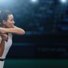 Female tennis player about to strike tennis ball - blog of pain free tennis performance